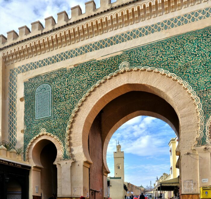 A historic Moroccan gate showcasing traditional old architecture with intricate designs and ornamental details.